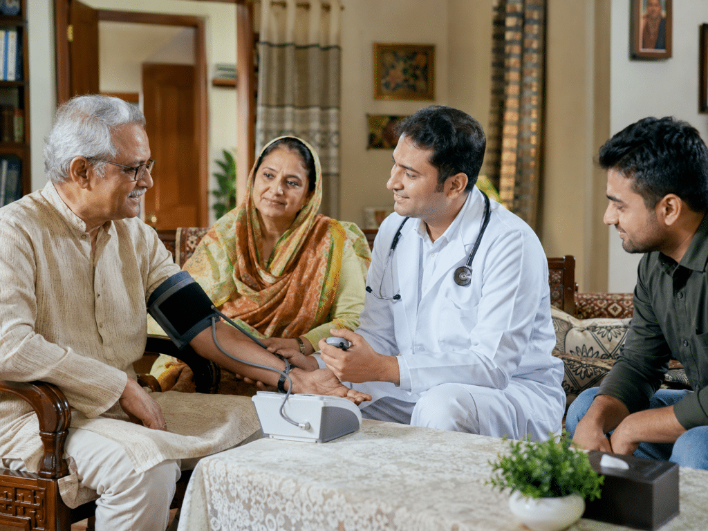 Doctor home visit Dhaka providing medical care to elderly patient at home with family support